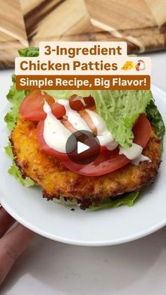 chicken patties with tomatoes and lettuce on a white plate