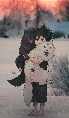 a person holding a dog in the snow