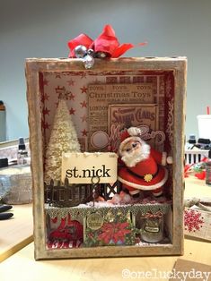 a christmas card holder with a santa clause in it