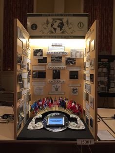 a display case with many different items on the front and back sides, including flags