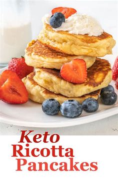 the cover of keto ricotta pancakes with strawberries and blueberries on top