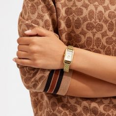 Inspired by the sleek designs of 1920s Art Deco the Cadie watch has an elegant long and lean silhouette. The gold tone bracelet timepiece features a dial detailed with our iconic Horse and Carriage motif. | Coach Cadie Watch, 20 Mm X 32.5 Mm - Women's - Gold Coach Women Watch, Luxury Coach Jewelry With Polished Finish, Luxury Coach Watch For Formal Occasions, Coach Cadie Watch, Art Deco Watch Women, Square Watches, Vintage Gold Watch, Art Deco Watch, Coach Watch