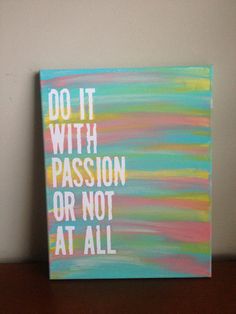 a painting that says do it with passion or not at all on a wooden table