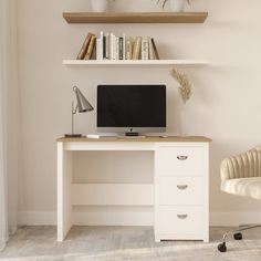 a white desk with a computer monitor and keyboard on it next to some bookshelves