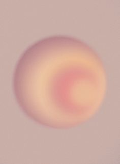 a blurry image of an orange and pink object on a white background, with only the top half visible