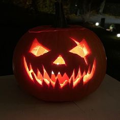 a carved pumpkin sitting on top of a table