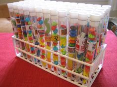 several plastic containers filled with different colored markers