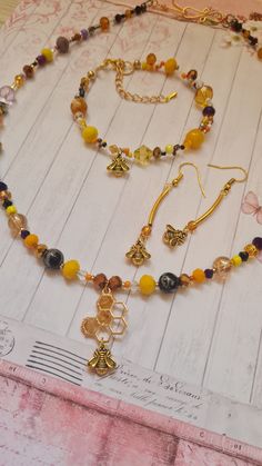 Beautiful handmade honey bee jewelry set - stylish and elegant, a great gift for a loved one - or for yourself! Made with lots of love and attention to detail. Stylish mix of glass/crystal beads with cute little honey bee pendants. Necklace - 50cm / 20inch long with a handmade S-style hook clasp Bracelet - 20cm / 8 inch long with extra 5cm / 2 inch extension chain. Multi-thread, braided. Earrings - 5cm / 2 inch long Braided Earrings, Honey Bee Jewelry, Pendants Necklace, Bee Jewelry, Bee Pendant, Clasp Bracelet, Set Necklace, Hook Clasp, Bracelet Clasps