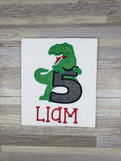 Dinosaur theme birthday shirt with name and age Dinosaur Theme Birthday, Embroidered Dinosaur, Birthday Boy Shirts, Dinosaur Theme, Boys Graphic Tee, Boys Birthday, Theme Birthday, Dinosaur Birthday, Birthday Shirt