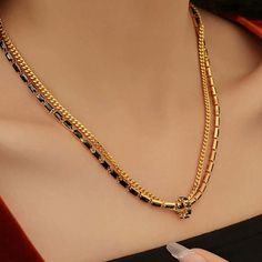 ✦ This Black and Gold Layered Tennis Chain Necklace boasts a sophisticated and exclusive design, perfect for dinner, prom, or graduation. Its two-tone double strand chain is adorned with black and baguette-cut cubic zirconia, exuding baroque and vintage luxury. The simple ring pendant at the center adds a tasteful finishing touch, perfectly complementing the intricate and elegant chain. ----------- DETAILS ----------- - Color: Gold & Black - Chain Length: 40.6cm + 8.5cm - Materials: Cubic Zircon Tennis Chain Necklace, Elegant Gothic, Tennis Chain, Simple Ring, Crystal Hoop Earrings, Nose Rings Hoop, Ring Pendant, Fashion Jewelry Earrings, Black Chain