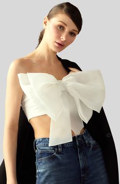 Black oversized organza bow bandeau top.Fit: model is 5'10" and wears a size S.Complete the look: Taffeta Cargo Skirt & Oversized Wool Blazer Black oversized organza bow bandeau top. Oversized 3D appliqué organza bow Strapless bandeau style top Fabric content: 100% polyester Care instructions: dry clean only Fit: model is 5'10" and wears a size S. Complete the look: Taffeta Cargo Skirt & Oversized Wool Blazer Organza Midi Skirt, Bow Bandeau, Cupid's Bow, Organza Bow, Taffeta Skirt, White Bandeau, Cotton Midi Skirt, Cupids Bow, Latest Skirts