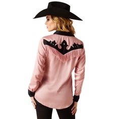 Cowgirl-tested, rodeo-loved, this retro top makes a statement wherever it goes. Crystal snaps glitter under the arena lights, while flowy fringe and classic boot-inspired details add true western style. Wilder Shirt | Product Features : 0 : Western fringe detail|Crystal snap closure | Women's Wilder Shirt in Zephyr 100% Viscose. Imported, Size: Large by Ariat Western Shirt, Cowgirl Button Up Shirt, Western Style Button-up Shirt For Western-themed Events, Pink Western Shirt, Womens Western Outfits, Space Cowgirl Costume, Western Show Shirts Pink, Spring Rodeo Button-up Shirt, Western Glam