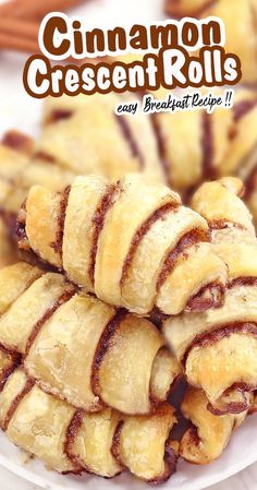 cinnamon crescent rolls on a white plate with cinnamon sticks in the background and text overlay reading cinnamon crescent rolls easy breakfast recipe