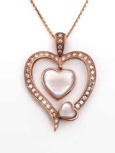 Gorgeous Love gift all-natural diamond and pink mother of pearl set in 18k solid rose gold heart pendant and linked chain necklace. Total weight: 7.8 grams Heart pendant size: 34*24 mm Chain length: 18 inches Total diamond weight: 0.46 tcw (stamped) Clarity: VS2 Color: G It comes in a nice gift box! Luxury Rose Gold Heart Necklace For Anniversary, Heart-shaped Pearl Pendant For Mother's Day, Elegant Heart-shaped Mother Of Pearl Jewelry, Gold Bar Pendant, Gold-tone Heart Pendant Necklace For Valentine's Day, Valentine's Day Gold-tone Heart Pendant Necklace, Heart-shaped Diamond Accented Pendant Necklace For Valentine's Day, Map Pendant, Rose Gold Heart