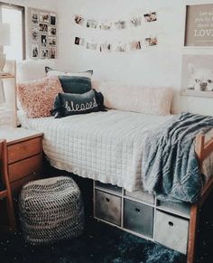 a bedroom with a bed, dressers and pictures on the wall