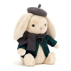 a white stuffed rabbit wearing a green coat and black hat with a scarf around it's neck