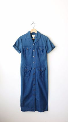 "Women's Blue Denim Short Sleeve Shirt Dress/Maxi Dress. It comes with a waist belt.  Measurements Tagged size        : Women's 2  Length                 : 45\" Armpit to armpit: 17\" Shoulder             : 14 1/2\" Shoulder to end of Sleeve: 6 1/2\" Waist                   : 31\" Hips                     : 36\" Condition           : Gently used. There's no stains or holes. Good condition. ※Please read the policy before you purchase※" Collared Denim Dress For Summer Workwear, Button-up Denim Dress For Workwear, Fitted Button-up Denim Dress For Work, Fitted Summer Shirt Dress With Pockets, Fitted Short Sleeve Denim Dress For Work, Fitted Medium Wash Denim Dress With Short Sleeves, Blue Short Sleeve Denim Dress With Pockets, Belted Medium Wash Dress For Work, Belted Blue Denim Summer Dress