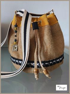 a small purse sitting on top of a glass table