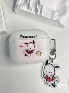 a keychain with an image of a cartoon character on the front and back