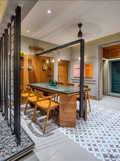 a dining room with a table and chairs