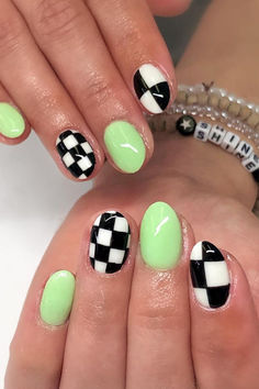 Chic meets vibrant with these stunning oval nails featuring classic checkered patterns in bold black and white, paired with a pop of neon green for a trendy and eye-catching look! 🖤💚✨ // Photo Credit: Instagram @nailsbyjaneb Checkered Nails Almond Shape, Red And Checkered Nails, Neon And Checkered Nails, Olive Green Checkered Nails, Easy Checkered Nails, Pop Punk Nails, Checked Nails Designs, Checkers Tattoo