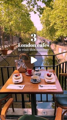 an outdoor dining area with tables and chairs, overlooking the river in london's east end