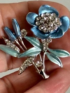 Blue enamel and crystal flower brooch set on silver colour metal with a roll over clasp Silver Enamel Pin For Wedding, Silver Enamel Wedding Pin, Blue Flower-shaped Jewelry Brooch, Blue Floral Brooch Jewelry, Silver Flower-shaped Brooches With Rhinestones, Lapel Pins Wedding, Customized Photo Gifts, Gifts For Fiance, Photo Charms