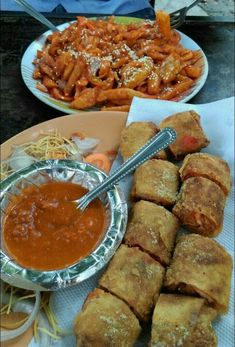 some food is sitting on a table with other foods