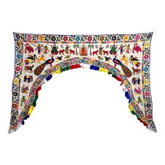 an arch made out of colorful fabric with horses and flowers on the sides, in different colors