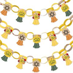 an assortment of key chains with different designs on them, all decorated in yellow and green