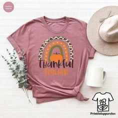 Thankful Teacher T-Shirt, Thanksgiving Rainbow Teacher Shirt, Thankful Gift For Teacher, Teachers Pumpkin Season Outfit, Fall Teacher Gift Welcome to my shop, I am a professional designer and craft my own shirts. I started this journey from scratch and have gained lots of experience. I can craft custom shirts with custom designs. Our handmade, specially designed shirts will be the perfect choice for your celebrations, vacations, graduations or birthday & wedding parties and holidays.  Discount a Basic Pink T-shirt For Fall, Fall Teacher Gifts, Designed Shirts, Thanks For The Gift, Pumpkin Season, Pumpkin Seasoning, Gift For Teacher, Wedding Parties, Outfit Fall