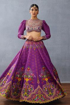 Purple attached cancan lehenga with mughal, floral, rose print all over. Paired with sequin, thread embroidered blouse and scallop bordered dupatta. - Aza Fashions Elegant Purple Lehenga With Motifs, Purple Silk Choli For Wedding, Fitted Purple Sets With Motifs, Purple Fitted Sets With Motifs, Silk Choli With Tilla For Wedding, Purple Silk Lehenga For Wedding, Purple Silk Wedding Lehenga, Purple Sharara With Motifs In Traditional Drape, Purple Motif Sharara With Traditional Drape