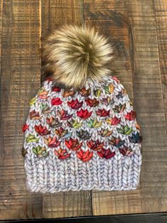 A great neutral and colorful flower winter hat. Pattern design is @bknitshandmade and knitted by me. This is an adult size hat that fits most head circumference between 19-23"  I use Malabrigo yarn (100% merino wool) in an assortment of colors.  Colors listed may not be solid but a mix of colors as they are hand dyed.  ✨Customize It! ☑️ I can make this in any size from 6-12 mo, toddler, 4-6yrs and adult.  ☑️ Poms can be customized by color Care instruction: ☑️ hand wash, lay flat to dry When can I expect my purchase: ☑️ turn around time is typically 1-2 weeks, as all my items are made to order. However, if you need an item sooner, and as long as I have the yarn in stock, I can probably accommodate your request  ‼️  Message me prior to discuss colors, size and pricing! ‼️ Winter Hat Pattern, Crochet Winter Hat, Hat With Flowers, Malabrigo Yarn, Crochet Winter, Color Care, Colour List, Head Circumference, Winter Hat