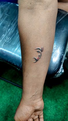 a person with a small tattoo on their leg