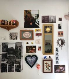 the wall is covered with pictures and other items