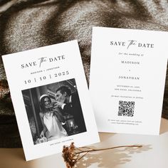 two wedding save the dates cards sitting on top of a bed next to each other