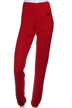 These pants are baggy and have a lose elastic on the waist allowing for comfort and the ability to pull them up or wear them low on the hips. They are very light and roomy to allow for air flow. The hem is slightly gathered. Red Baggy Sporty Bottoms, Red Baggy Long Pants, Red Baggy Cotton Sweatpants, Red Baggy Wide-leg Harem Pants, Moisture-wicking Red Sportswear Pants, Los Angeles Luxury, Tennis Skirts, Soft Red, Solid Red