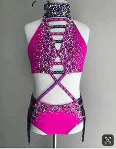 a woman's leotard with purple sequins on it