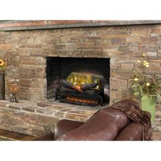 a stone fireplace with a fire in it