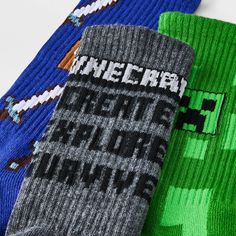 They'll love taking on their day in comfort and cool style with this 3-Pack of Minecraft Crew Socks. Made from a softy, comfy fabric suitable for year-round wear, these printed crew socks are also designed with spandex for stretchy comfort. The pack includes three pairs, each in a different color and featuring a different Minecraft game print or logotype that fans of the game will love. Cotton Socks For Winter Playtime, Casual Cotton Socks For Playtime, All Minecraft, The Pack, Crew Socks, Online Purchase, The Game, Fabric Weights, Minecraft