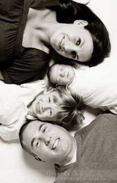 a family laying on top of each other