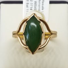 "Vintage 14K Yellow Gold and Jade Ring Size 5.75. Not marked but tested positive as 14K. Main stone is approx. 13 x 7mm. Weighs 1.9 dwt. We do not check prongs for wear or stones for looseness. All items are sold AS IS, noting that we are a resale shop so everything here had a previous owner! We will include flaws in the description when noted. This is one of the reasons our items are more affordable than new at a jewelry store. Are these stones real or fake? Aside from diamonds, we do not know Marquise Green Ring In 14k Gold, Green Marquise Ring In 14k Gold, Green Marquise 14k Gold Ring, Classic Green Marquise Rings, 3mm Ring, European Jewelry, Vintage Fine Jewelry, Star Sapphire, Jade Ring