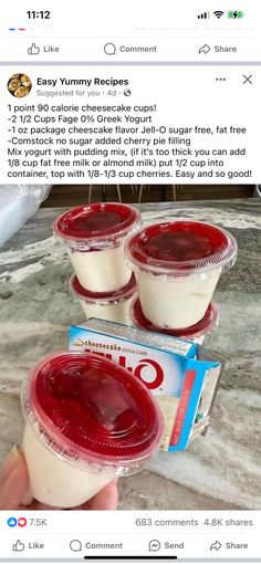 two plastic cups filled with yogurt sitting on top of a counter