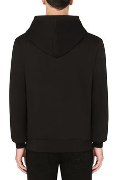 Find DOLCE & GABBANA Cotton Jersey Hoodie on Editorialist. Slim fit, adjustable drawstring hood, long sleeves, cuffs, zipper closure, metallic logo on the front, side pockets, ribbed Luxury Sweatshirt With Drawstring Hood For Winter, Luxury Long Sleeve Hoodie With Ribbed Cuffs, Luxury Hooded Jacket With Double-lined Hood, Luxury Black Hoodie With Ribbed Cuffs, Luxury Hooded Sweatshirt With Ribbed Cuffs, Luxury Black Hoodie For Winter, Luxury Hooded Hoodie For Streetwear, Luxury Long Sleeve Hoodie With Double-lined Hood, Luxury Streetwear Hoodie With Ribbed Cuffs