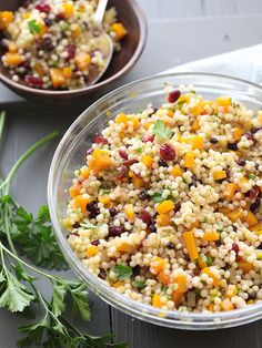 two bowls filled with food sitting on top of a table