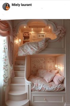 there is a bunk bed with pink pillows on it and stairs leading up to the second floor