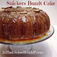 a bundt cake is sitting on a glass platter