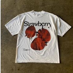 Strawberry Graphic Tee - Fresh Fruit-Inspired Casual Fashion Add a pop of freshness to your wardrobe with this bold tee featuring vibrant strawberry graphics and elegant "Strawberry" text. Perfect for fruit lovers and those who enjoy unique, food-inspired fashion. 👕 Material: 100% Cotton 🎨 Design: Bold Strawberry Graphic with Stylish "Strawberry" Text 📏 Sizes: M-3XL ⏳ Custom Creation Time: Please allow 1-2 weeks for production. #StrawberryTee #FruitInspiredFashion #GraphicTshirt #CasualWear # White Relaxed Fit T-shirt With Strawberry Print, Trendy Red T-shirt With Strawberry Print, Casual White Tops With Fruit Design, White Casual Top With Fruit Design, Casual White Top With Fruit Design, Retro Cotton Top With Strawberry Print, Vintage Cotton Tops With Fruit Print, Retro Spring Tops With Strawberry Print, Retro Spring Top With Strawberry Print