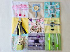 a patchwork wall hanging with various items on it