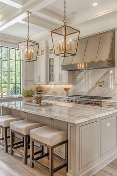 a large kitchen with marble counter tops and stools in front of the stove top